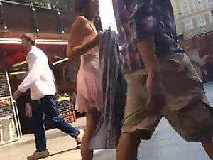 Voyeur peeps on appealing girl's skirt Picture 1