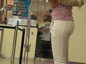 Hot tanned girl in tight white pants Picture 1