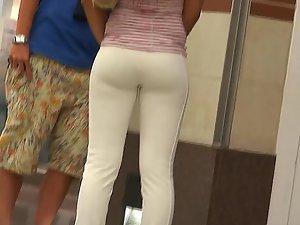 Hot tanned girl in tight white pants Picture 4