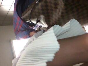 No panties in upskirt under a short white skirt Picture 5
