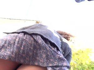 Wind shows brunette's bubble butt in upskirt Picture 7
