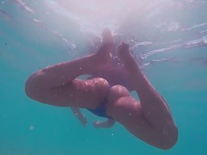 Underwater spying on young mermaid