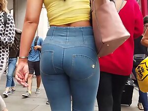 Tight ass fills jeans to maximum capacity