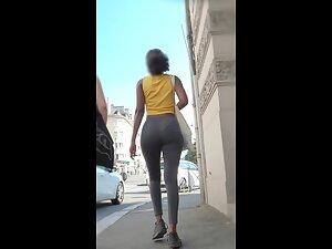 Stunning movement of black booty in grey leggings Picture 6