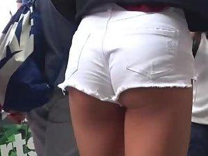 Teen girl keeps tugging shorts out of ass