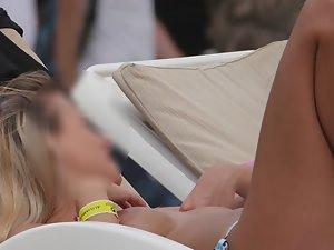 Smug girl chills in topless Picture 1