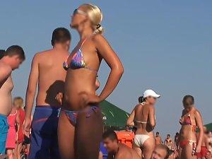 Sexy blonde can't resist the music on beach Picture 5