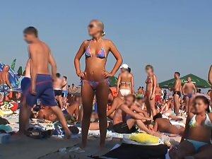 Sexy blonde can't resist the music on beach Picture 6