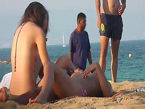 Voyeur notices lesbian girls on a beach Picture 7