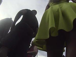 Upskirt of smug girl's hot ass in yellowish dress Picture 3