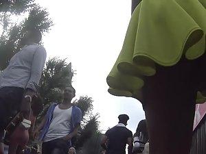 Upskirt of smug girl's hot ass in yellowish dress Picture 4