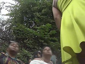Upskirt of smug girl's hot ass in yellowish dress Picture 7