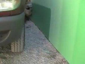 Girl busted as she pissed next to a wall