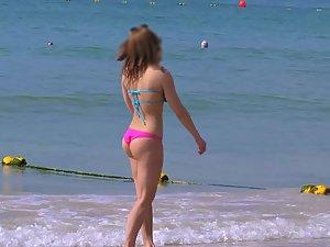 Voyeur checks out a fit girl on the beach Picture 2