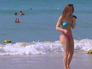 Voyeur checks out a fit girl on the beach Picture 5