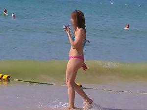 Voyeur checks out a fit girl on the beach