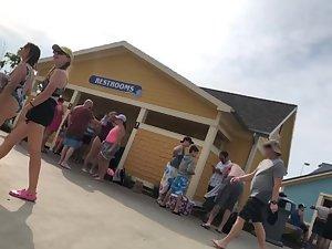 Amazing tattooed girl at water park entrance Picture 1
