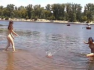 Nude girls swimming in a lake