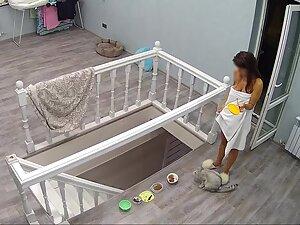 Hidden cam caught incredible naked woman feeding her cat Picture 2