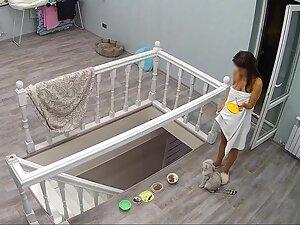 Hidden cam caught incredible naked woman feeding her cat Picture 3