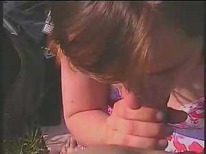 Girl sucks her man during a picnic Picture 2
