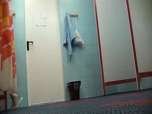 Milf got spied in a female locker room Picture 8