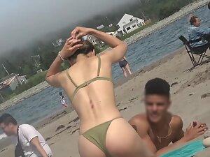 Checking out petite girl's ass and cameltoe in bikini Picture 5