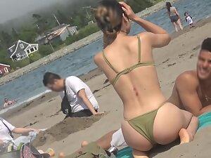 Checking out petite girl's ass and cameltoe in bikini Picture 6