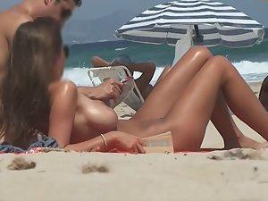 Stunning girl gets naked on beach Picture 6