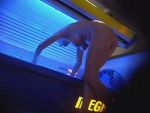 Mature lady wipes the tanning machine Picture 8