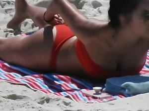 Spicy latina eats a banana on the beach Picture 1