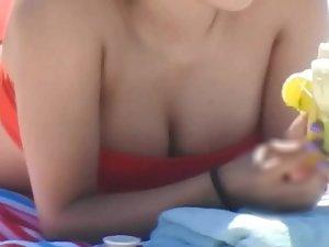 Spicy latina eats a banana on the beach Picture 6