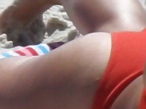Spicy latina eats a banana on the beach Picture 7