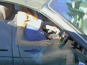 Upskirt of tattooed milf sitting in her car Picture 4
