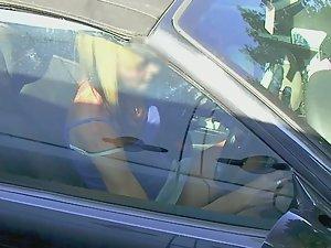Upskirt of tattooed milf sitting in her car Picture 5