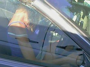 Upskirt of tattooed milf sitting in her car Picture 6