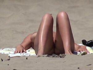 Nudist woman sunbathes and smokes a cigarette Picture 6