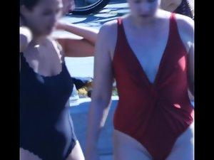 Meaty milf pussy barely fits inside a swimsuit Picture 7