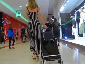 Hourglass body jiggling in jumpsuit with stripes