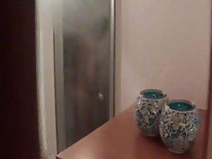 Sexy house guest spied in the shower