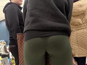 Greenish leggings encircle a hot ass