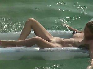 Gorgeous naked girl floating in water Picture 6