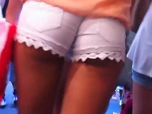 Two girls with shorts in their butt cracks