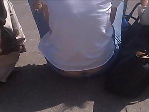 Thong and ass crack exposed while she is sitting Picture 3
