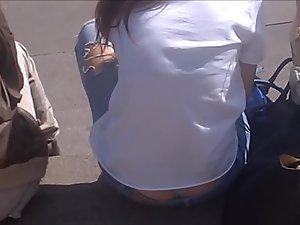 Thong and ass crack exposed while she is sitting Picture 5